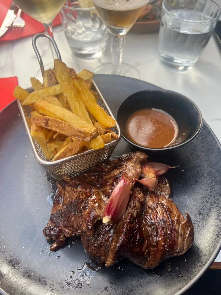 Grilled entrecôte with homemade chips and sauce at a restaurant