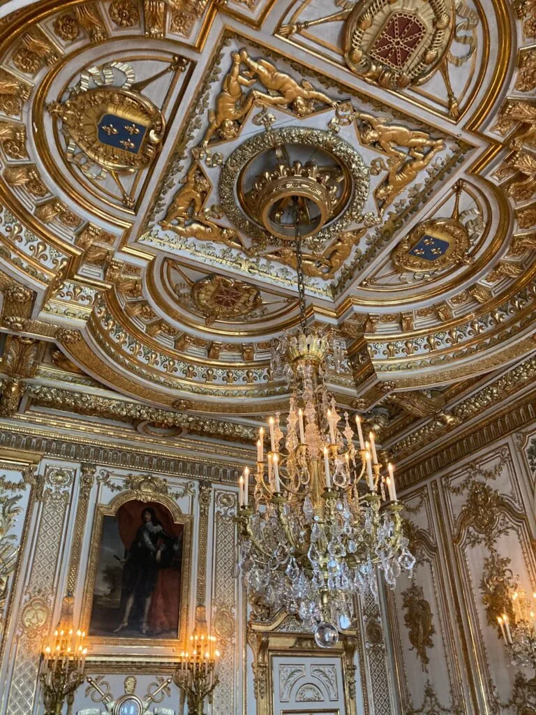 Baroque gilded ceiling with a crystal chandelier, Palace of Versailles