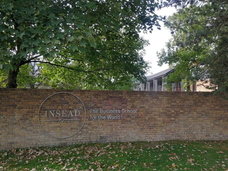 Brick wall featuring the INSEAD logo, a global business school