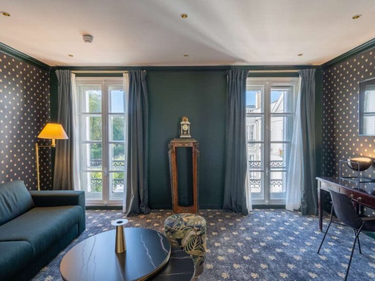 Salon de suite with Second Empire decor and large Black Eagle windows