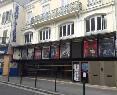 Front of the Ermitage cinema in Fontainebleau with film posters