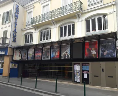 Front of the Ermitage cinema in Fontainebleau with film posters