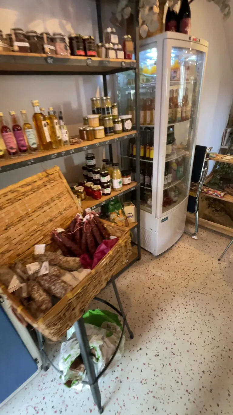 Maison Sumac delicatessen corner: sausages, jams, oils, mustards and refrigerated display case
