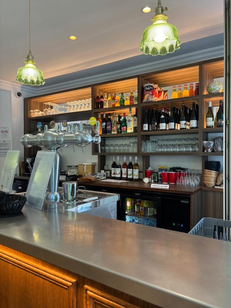 Elegant bar with beer dispenser and bottle shelves