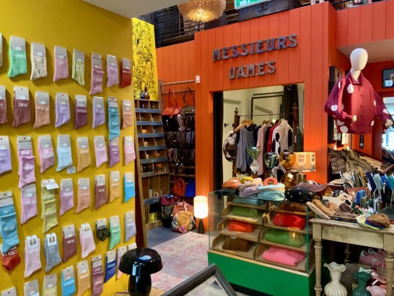 Wall of socks and the ‘Messieurs Dames’ section at Maison Madeleine in Fontainebleau