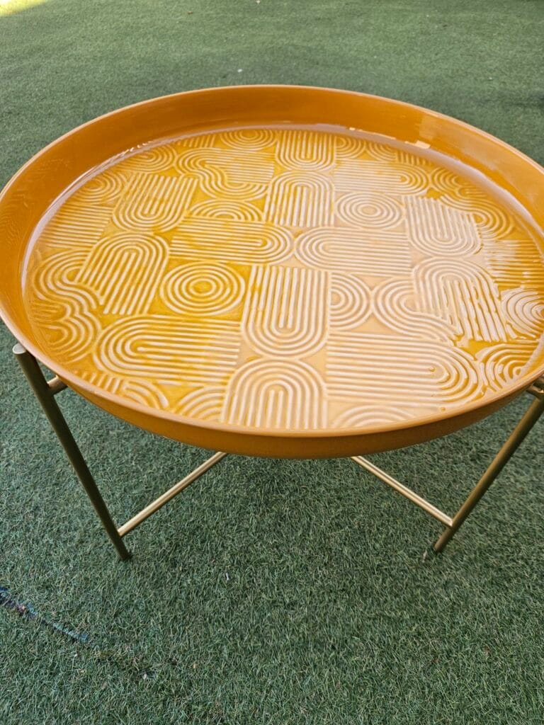 Decorative orange tray sold at Maison Madeleine in Fontainebleau
